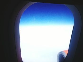 Close-up of cropped car against sky