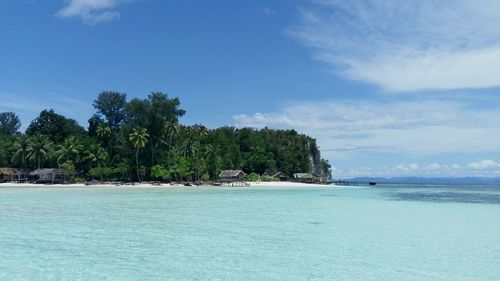 Scenic view of sea against blue sky