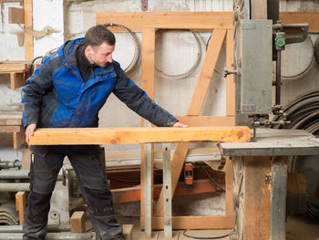 Carpenter working at workshop