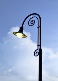 Low angle view of street light against sky