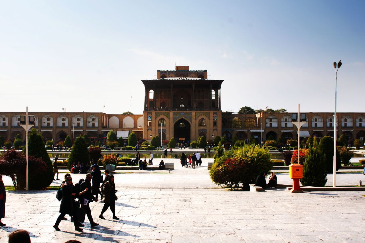 GROUP OF PEOPLE IN FRONT OF BUILDING