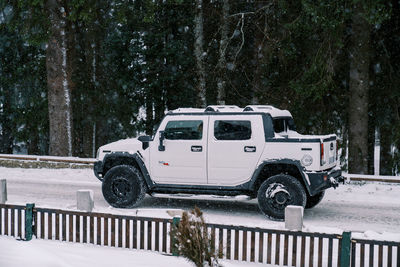 Car on snow covered field