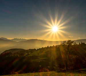 Scenic view of landscape against sky during sunset