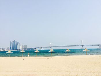 Scenic view of beach against clear sky