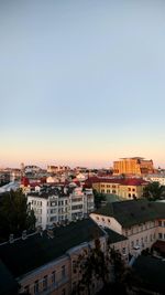 High angle shot of townscape against sky at sunset