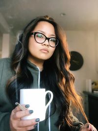 Portrait of young woman wearing eyeglasses