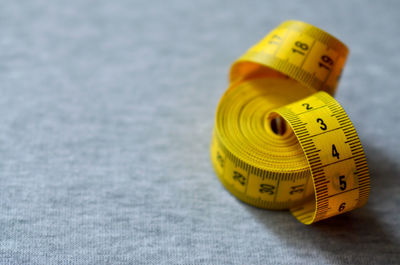 Close-up of tape measure on textile