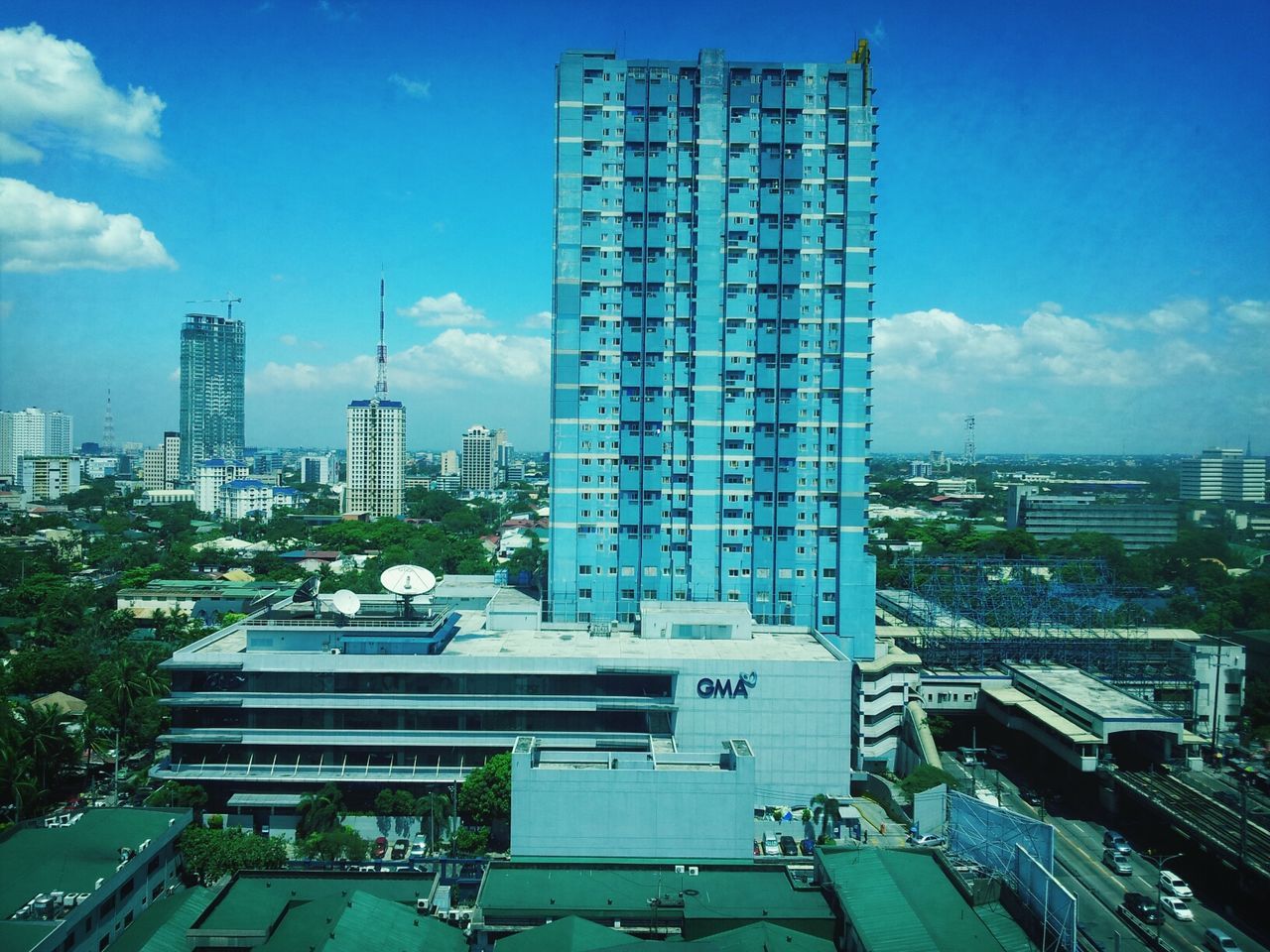 building exterior, architecture, built structure, city, skyscraper, blue, sky, modern, office building, tall - high, cityscape, tower, cloud - sky, cloud, building, urban skyline, day, city life, financial district, tall