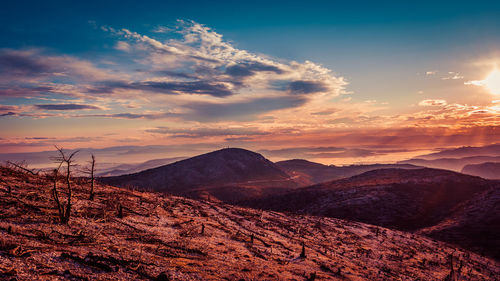 Scenic view of mountains against sky during sunset