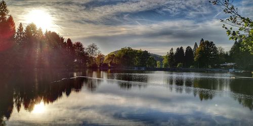 Scenic view of lake against sky during sunset