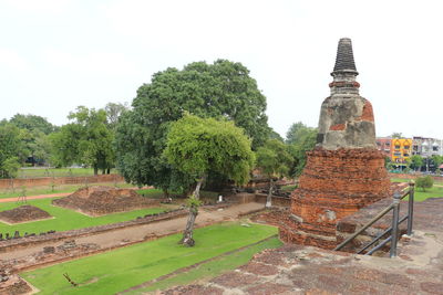 Panoramic view of temple on field against sky