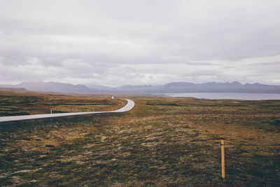 Scenic view of mountains against cloudy sky