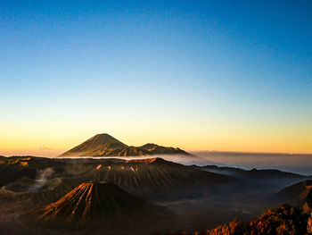 Scenic view of mountain against sky during sunset