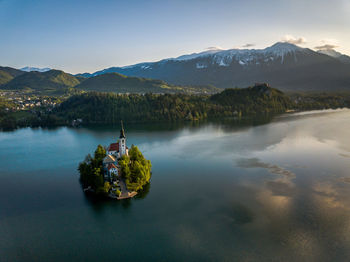 Scenic view of lake and mountains against sky