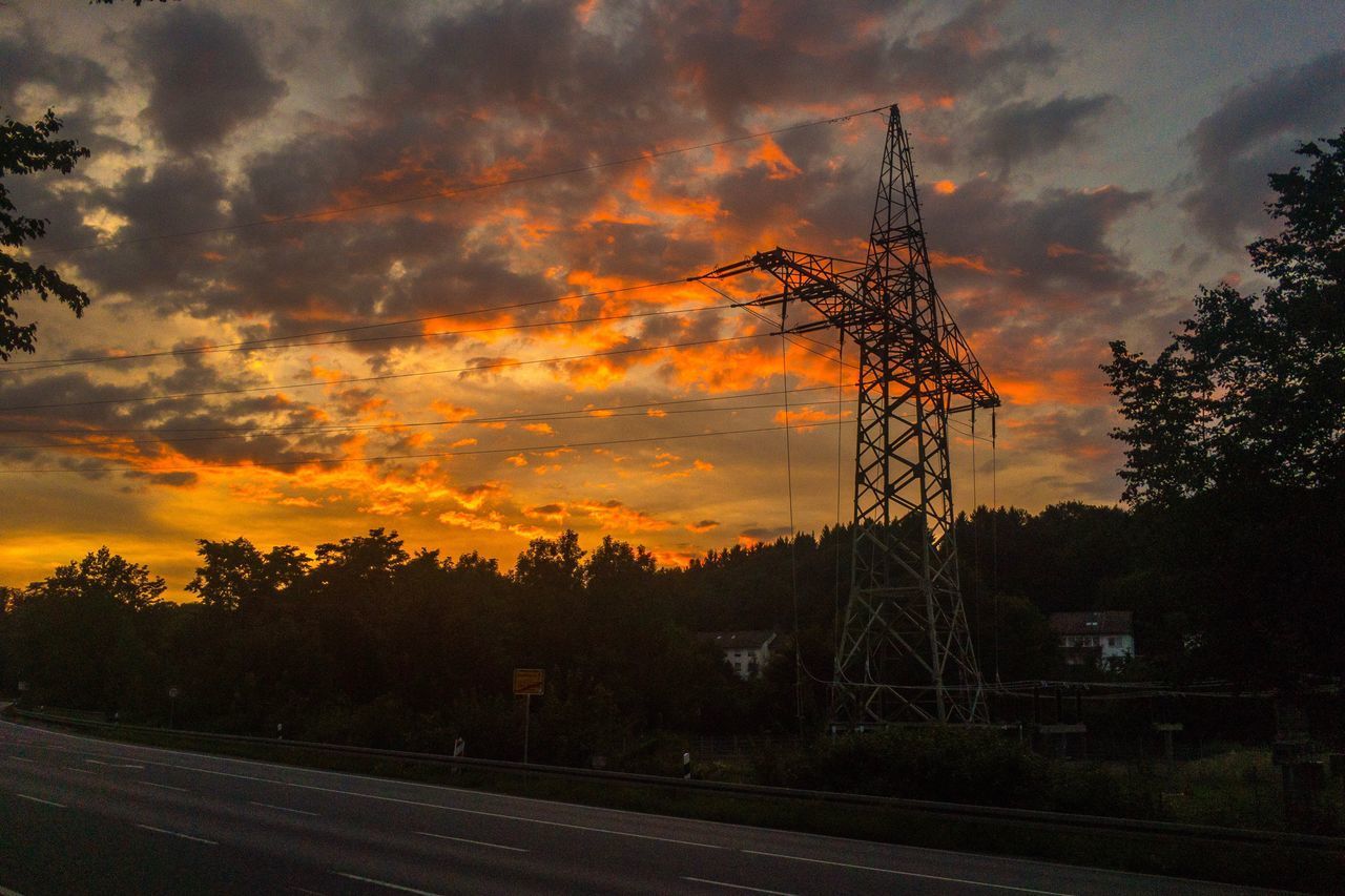 SILHOUETTE TREES AND ELECTRICITY PYLON AGAINST SKY AT SUNSET