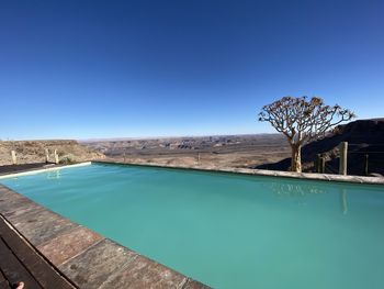 View of swimming pool against blue sky