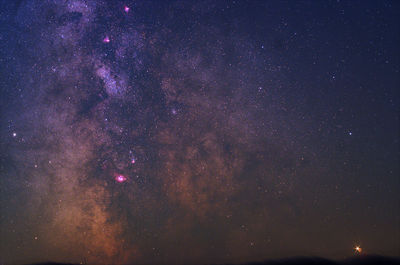 Low angle view of stars in sky at night