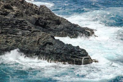 Waves splashing on rocks
