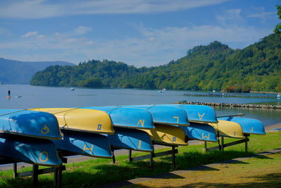 Boats moored in lake