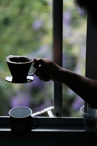 Woman holding coffee cup