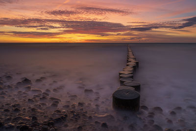 Scenic view of sea against sky during sunset