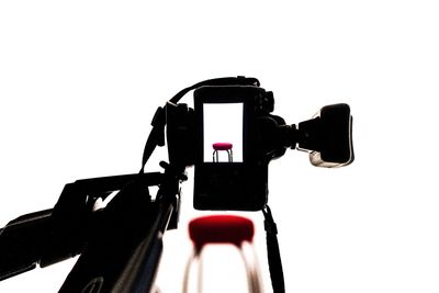 Close-up of camera over white background