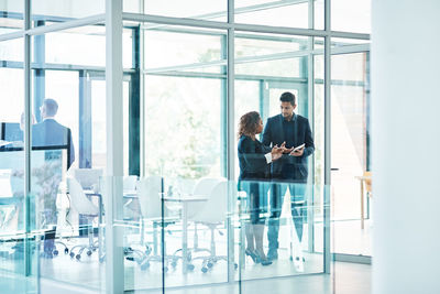 Business colleagues talking in office