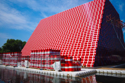 Stack of cans against sky