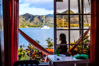 Woman relaxing on hammock