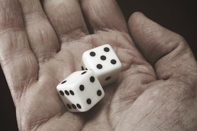 Close-up of human hand holding hat