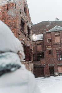 View of buildings against sky during winter