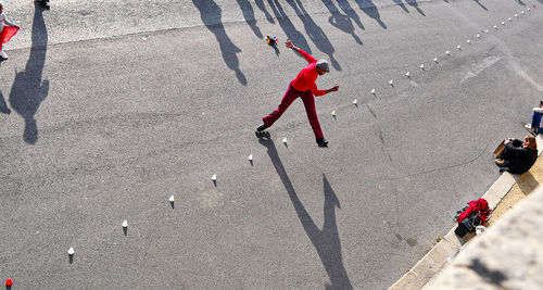 High angle view of people walking on road