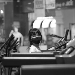 Rear view of couple sitting on table