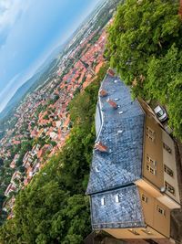 High angle view of trees and buildings against sky