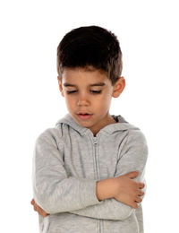 Boy looking away while standing against white background