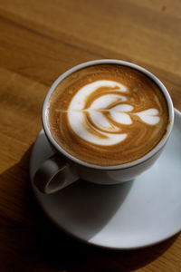 High angle view of cappuccino on table