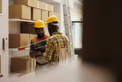 Rear view of man working in factory