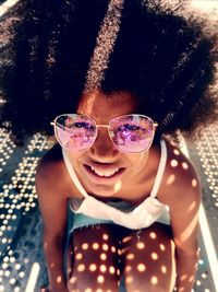 Portrait of a smiling girl wearing sunglasses