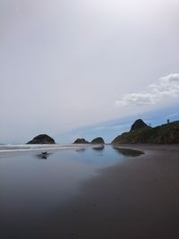 Scenic view of beach against sky