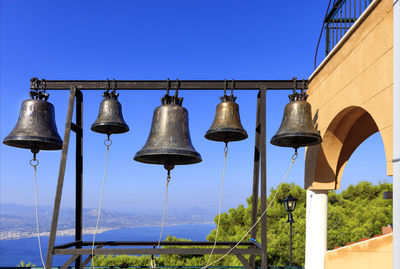 Orthodox bells of the nunnery of st. potapius against the blue sky, the mediterranean pine 