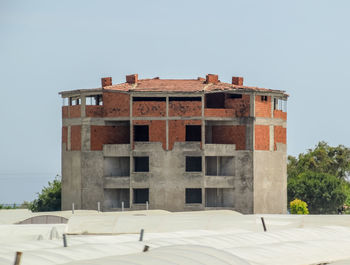 Low angle view of old building against clear sky