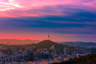 High angle view of buildings against sky at sunset