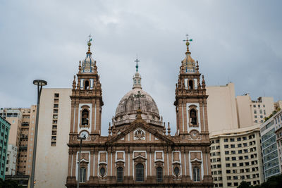 Low angle view of buildings in city against sky