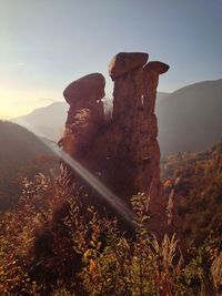 Rock formations against sky at piramidi di segonzano trento on sunny day