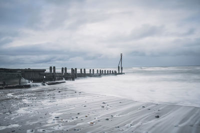 Scenic view of beach against sky