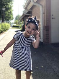 Portrait of smiling girl standing outdoors