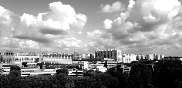 High angle view of buildings in city against sky