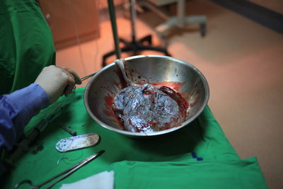 High angle view of person preparing food on table