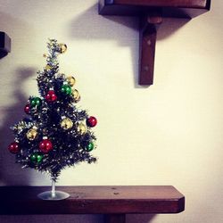 Close-up of decoration hanging on wall at home