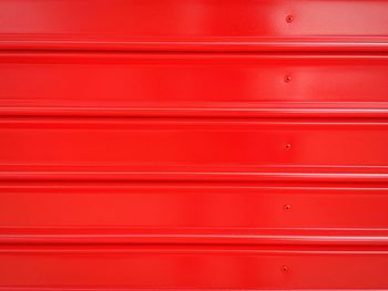 Full frame shot of red garage door